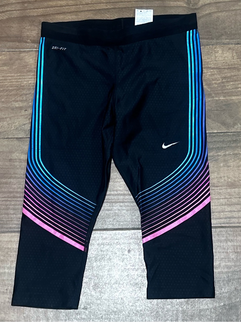 Nike Black Dri Fit Capri Leggings with Blue and Pink Gradient Stripes